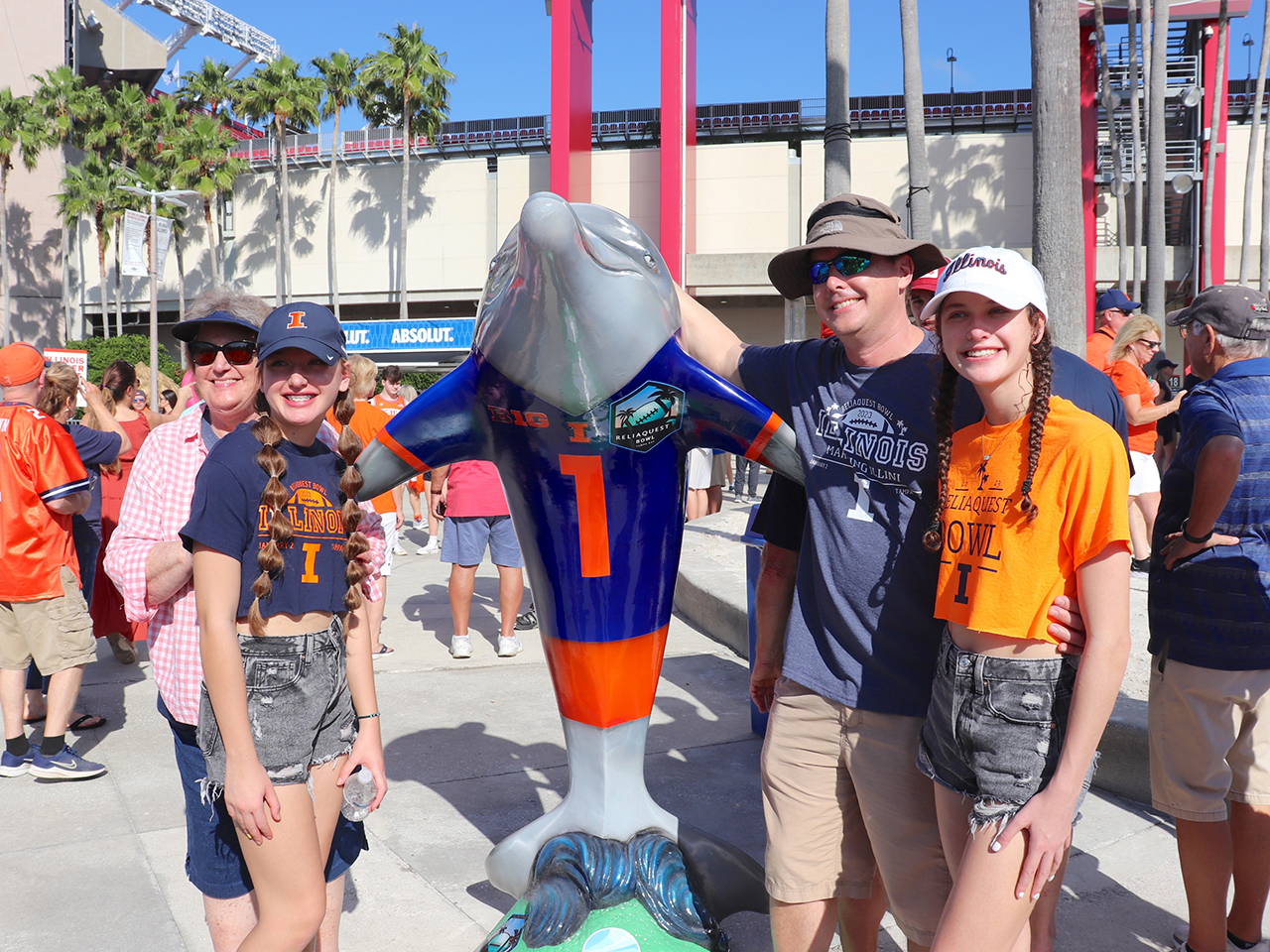 Fans pose with the Illini Dolphin